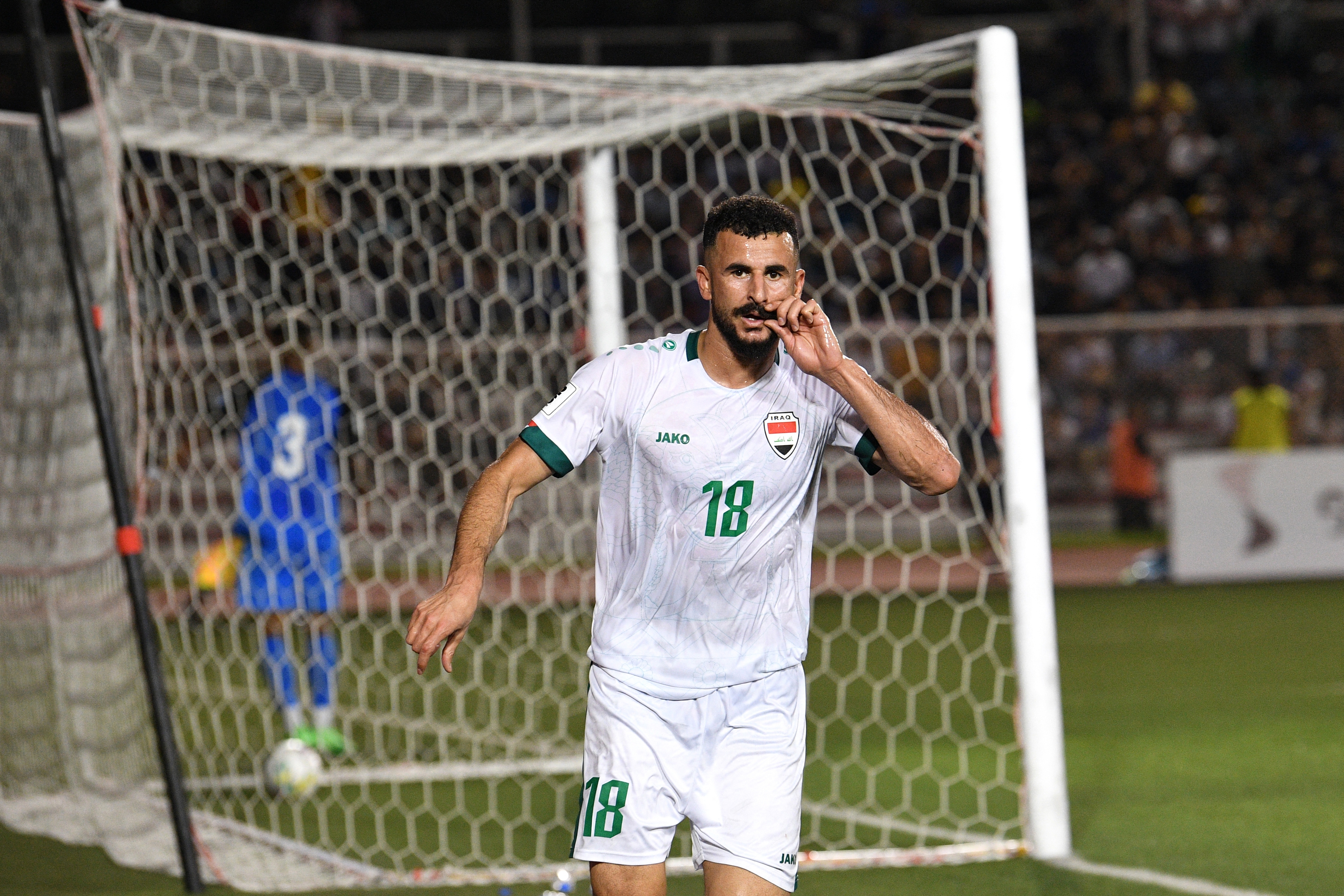 Iraq's Aymen Hussein reacts after a goal against the Philippines during the 2026 FIFA World Cup AFC qualifiers football match between Iraq and the Philippines at the Rizal Memorial Stadium in Manila on March 26, 2024. 
Ted ALJIBE / AFP