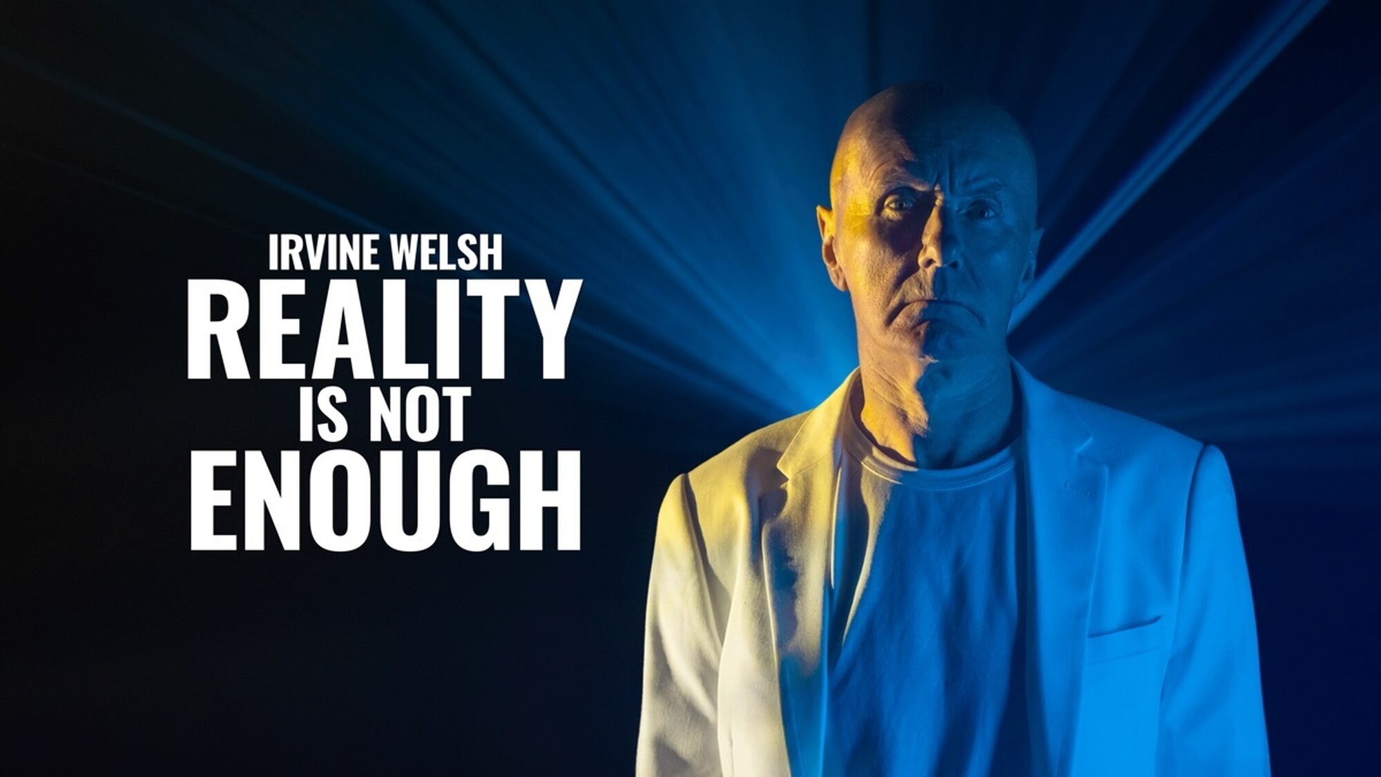 Man in wit pak staart mysterieus naar de camera met een blauwe laser achter zich en de tekst 'irvine welsh reality is not enough'