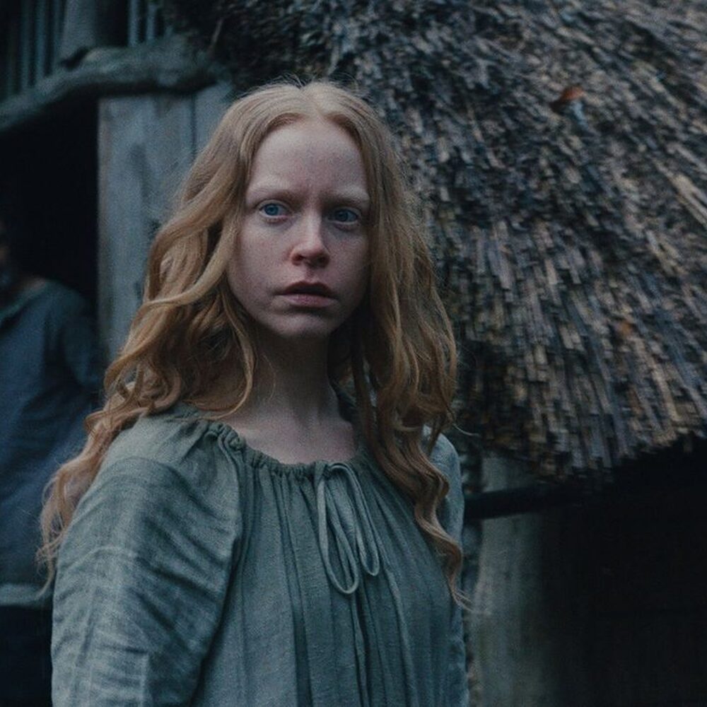 Vrouw in middeleeuws dorp